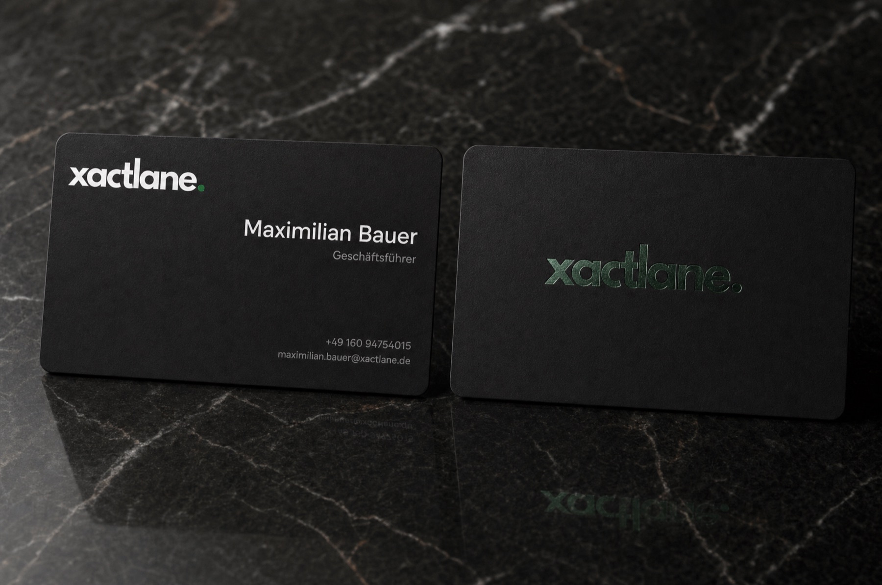 Xactlane business cards in black with foil logo